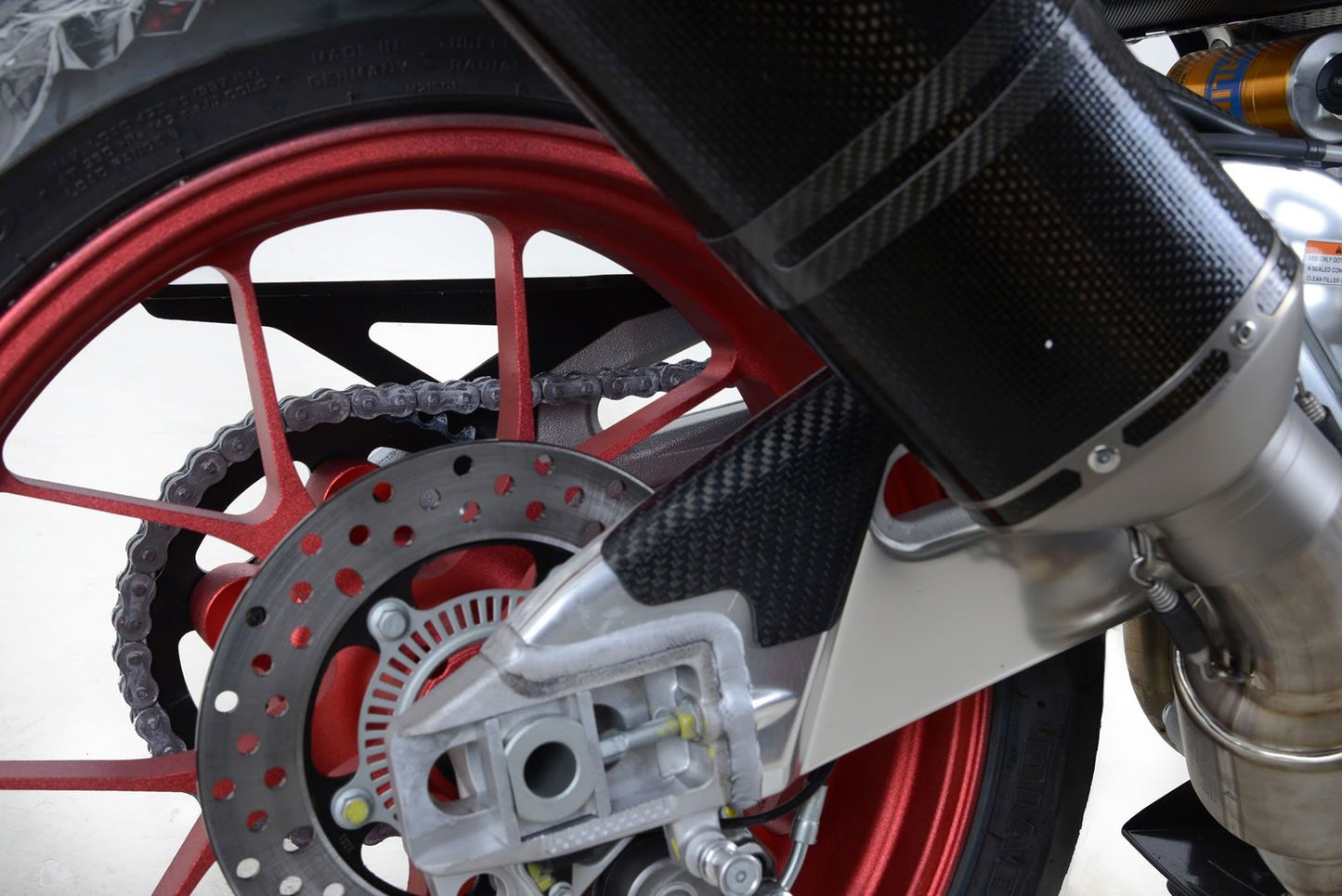 Protezione forcellone in carbonio (lato DX), Aprilia RSV4 RR/RF '15- / RSV4 1100 Factory '19- / V4 Tuono [R] '15- - finitura lucida